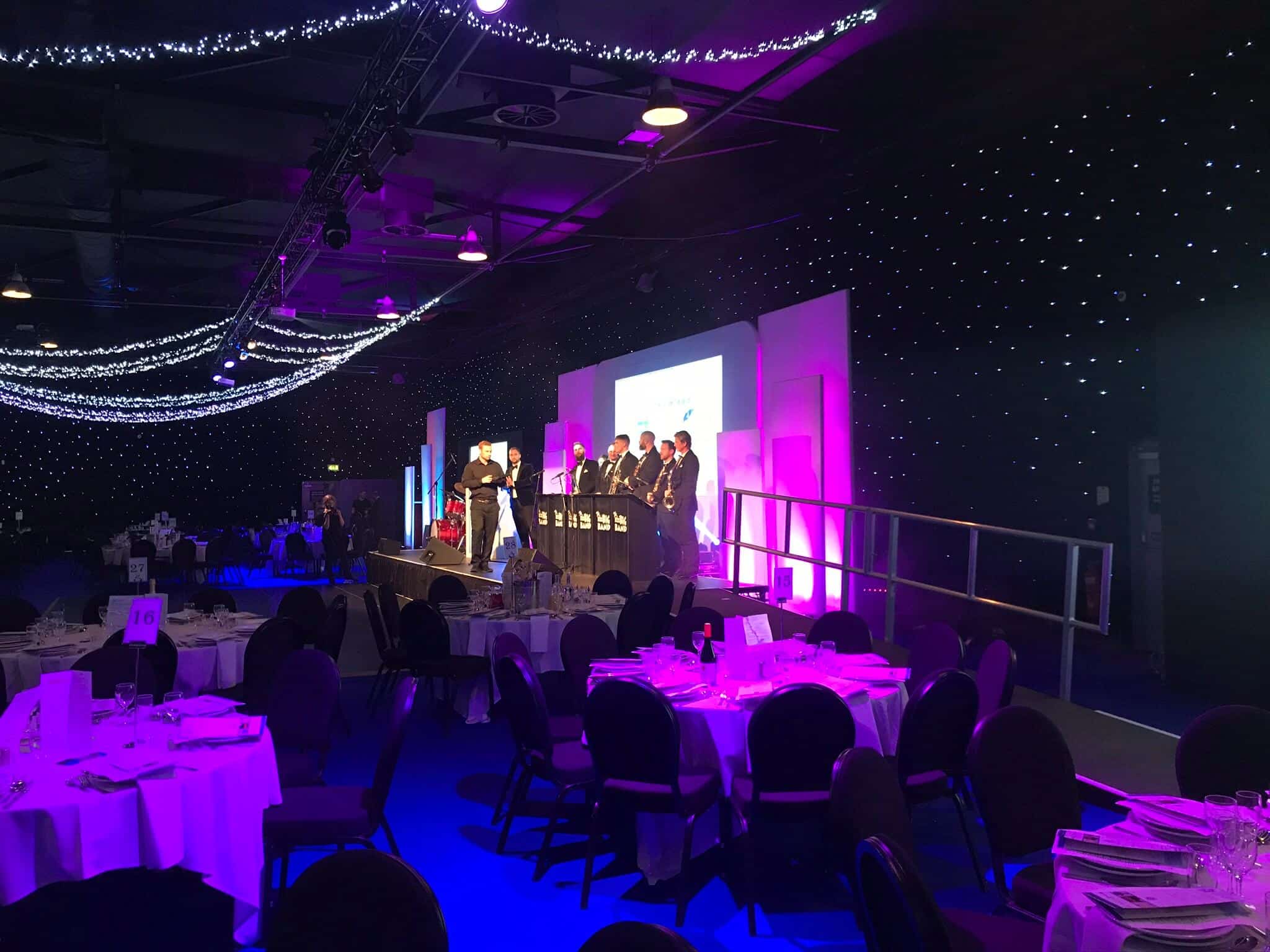 Awards presentation on stage at New Dock Hall